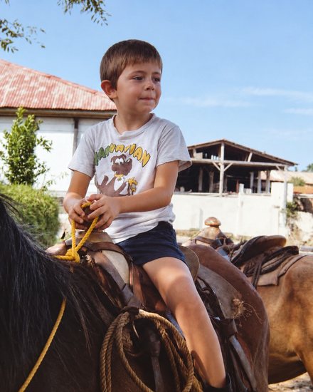 Robert as a child on horseback at Finca Rosario Churruaramos in Guatemala